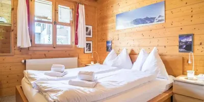 Ein Bett oder Betten in einem Zimmer der Unterkunft Burehüsli Axalp