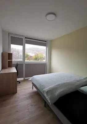 Ein Bett oder Betten in einem Zimmer der Unterkunft smallville