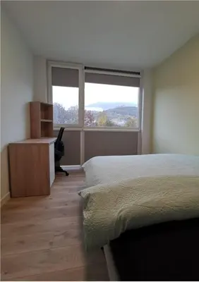 Ein Bett oder Betten in einem Zimmer der Unterkunft smallville