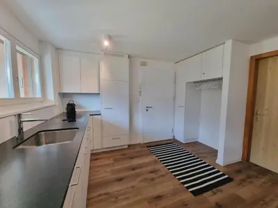 Küche/Küchenzeile in der Unterkunft Tarbey 39 Toplage an der Bergbahn Moderne Ferienwohnung mit grosser Panoramaterrasse
