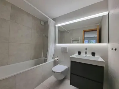 Ein Badezimmer in der Unterkunft Tarbey 39 Toplage an der Bergbahn Moderne Ferienwohnung mit grosser Panoramaterrasse