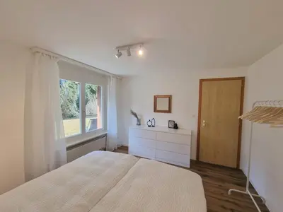 Ein Bett oder Betten in einem Zimmer der Unterkunft Tarbey 39 Toplage an der Bergbahn Moderne Ferienwohnung mit grosser Panoramaterrasse