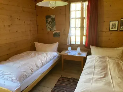 Ein Bett oder Betten in einem Zimmer der Unterkunft Berghotel Gasterntal