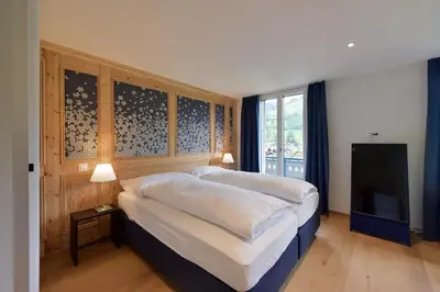 Ein Bett oder Betten in einem Zimmer der Unterkunft Bellevue Hotel & Apartments