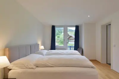 Ein Bett oder Betten in einem Zimmer der Unterkunft Bellevue Hotel & Apartments