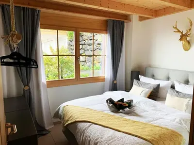 Ein Bett oder Betten in einem Zimmer der Unterkunft Königin der Alpen