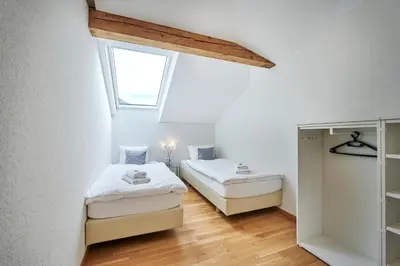 Ein Bett oder Betten in einem Zimmer der Unterkunft Aparthotel Krone - Self Check-In