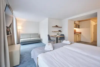 Ein Bett oder Betten in einem Zimmer der Unterkunft Aparthotel Krone - Self Check-In
