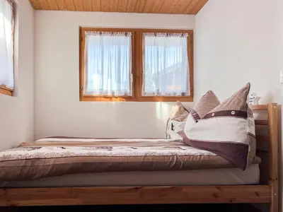 Ein Bett oder Betten in einem Zimmer der Unterkunft Chalet Sonne