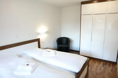 Ein Bett oder Betten in einem Zimmer der Unterkunft 2.5 Zimmerwohnung für Sportler & Familien WHG 132 & WHG 612