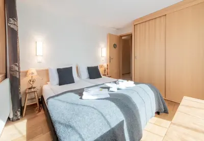 Ein Bett oder Betten in einem Zimmer der Unterkunft Chalet Sole Apt 3