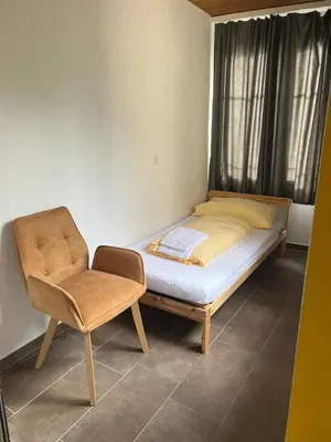 Ein Bett oder Betten in einem Zimmer der Unterkunft Apartment ROSY