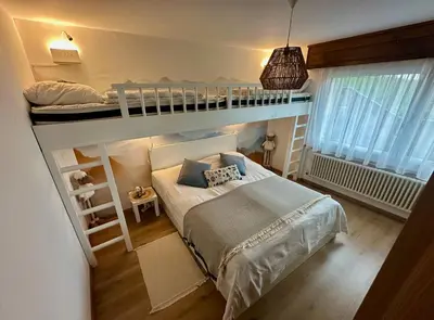 Ein Bett oder Betten in einem Zimmer der Unterkunft Appartement de vacances - ski-in ski-out