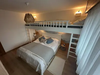 Ein Bett oder Betten in einem Zimmer der Unterkunft Appartement de vacances - ski-in ski-out