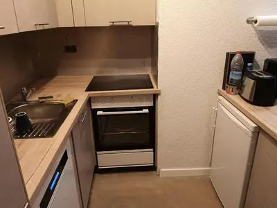 Küche/Küchenzeile in der Unterkunft Appartement proche remontées refait à neuf