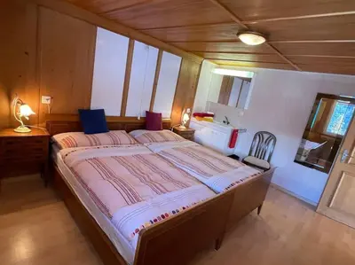 Ein Bett oder Betten in einem Zimmer der Unterkunft Apartment Chalet Im sunnigen Usblick